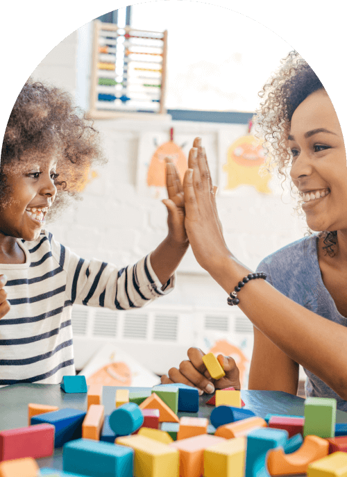 Teacher and child doing a high five