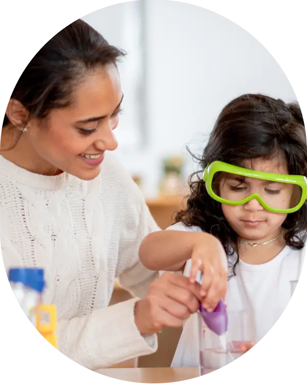 Teacher teaching science to a preschool child